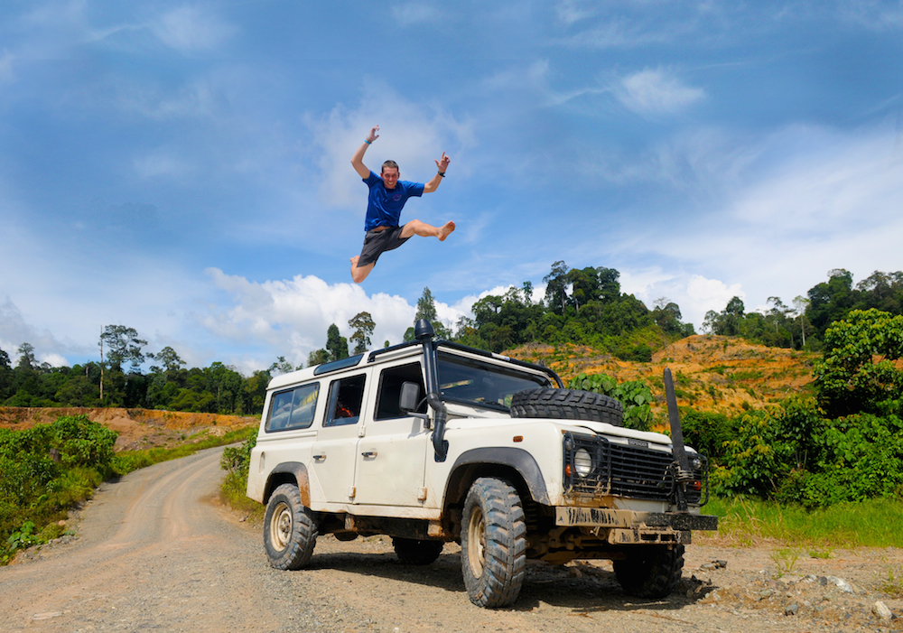 Man Jumping On Top Of 4x4 Car In Celebration